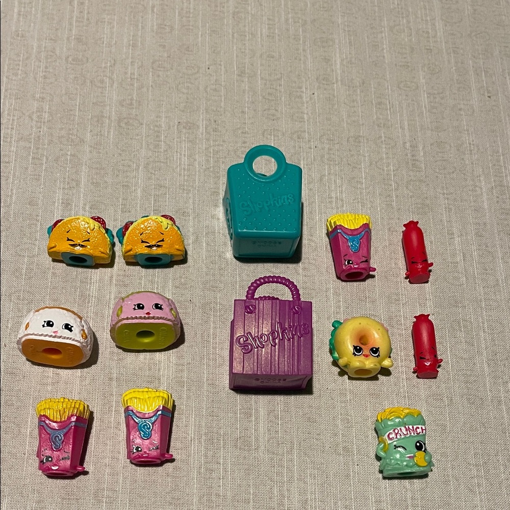 Shopkins, 11-Teal and Purple Shopkins with two shopping carts. Lot A6.